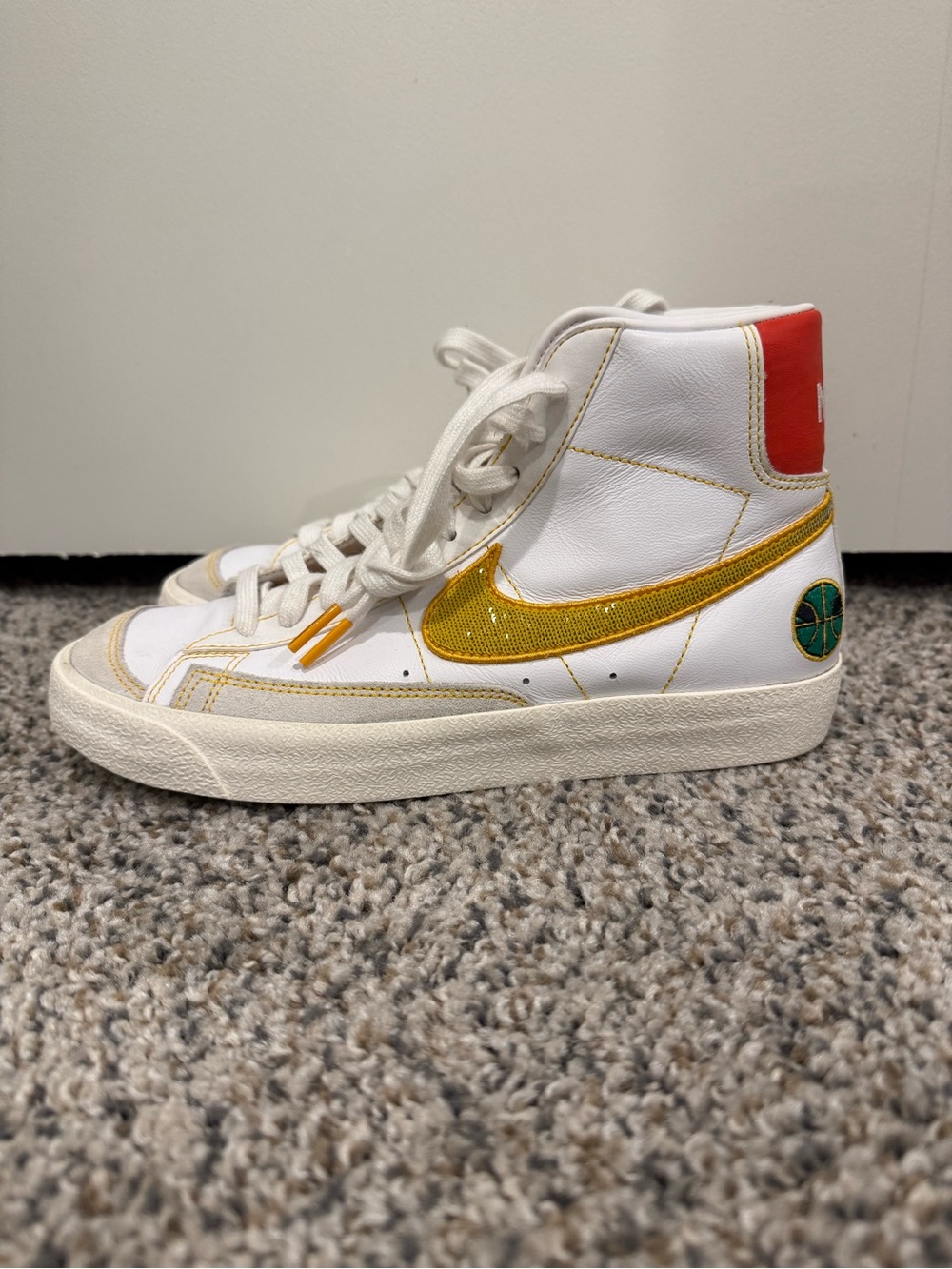 Nike White High-Top Sneakers with alternating Gold/Green Swoosh